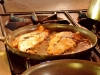 Fish filets cooking in the kitchen at Kismet Bar and Restaurant